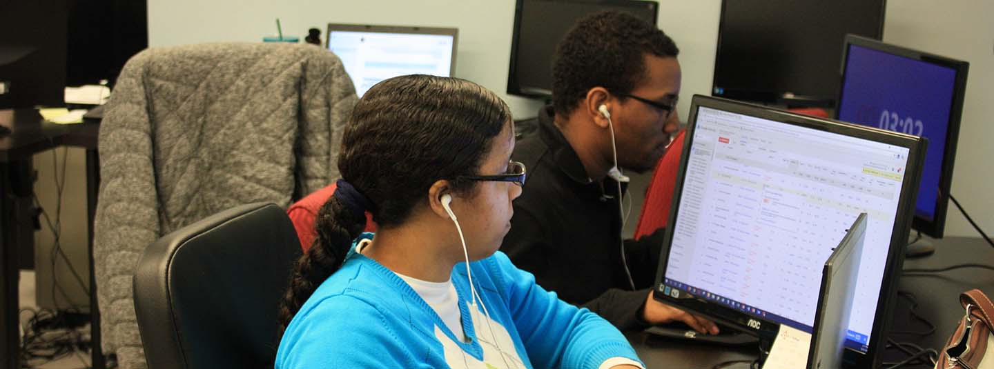 Young adults studying at a computer