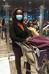 Stella Tai at the airport with luggage cart