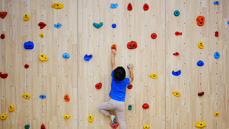 Kid rock climbing