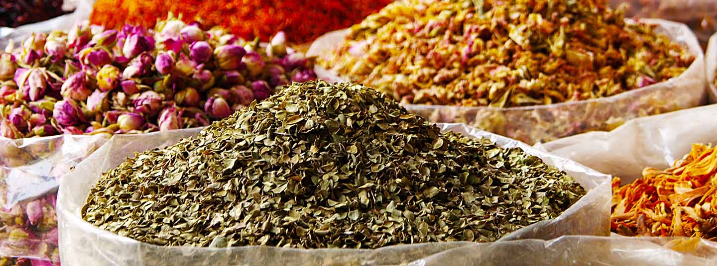 Bowls filled with colorful spices on a table