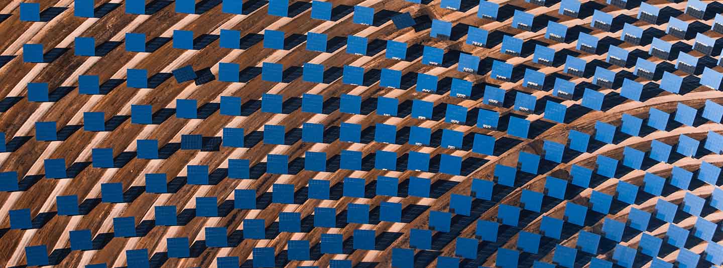 Overhead view of solar panels in an arched pattern