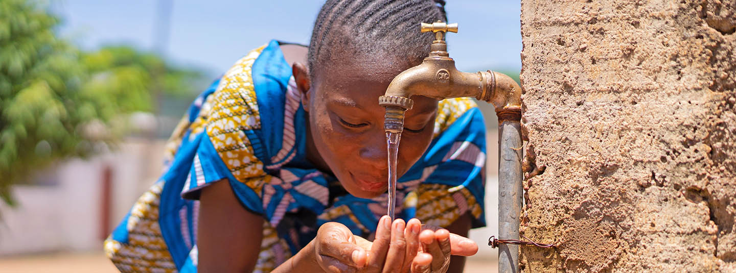 Candid picture of African Black Girl Drinking Water in Bamako Mali