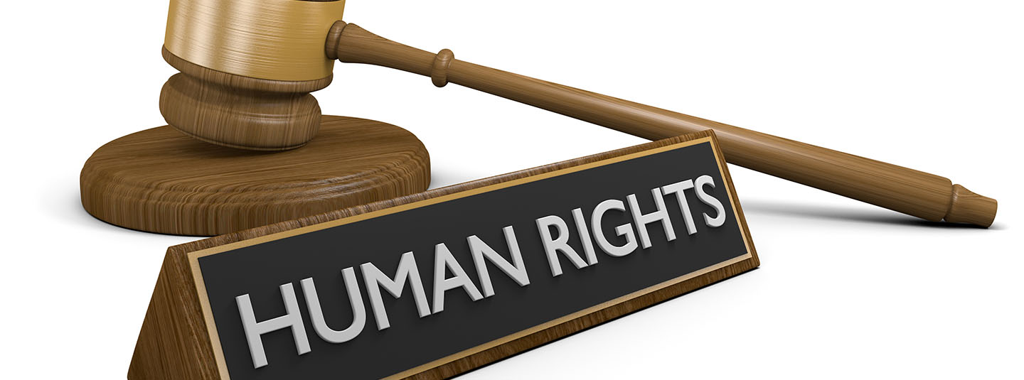 Gavel beside a nameplate engraved with human rights